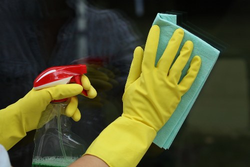 Office cleaners working in a modern Ealing workplace reception area