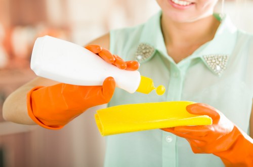 Local carpet cleaner treating stains in an Ealing living room